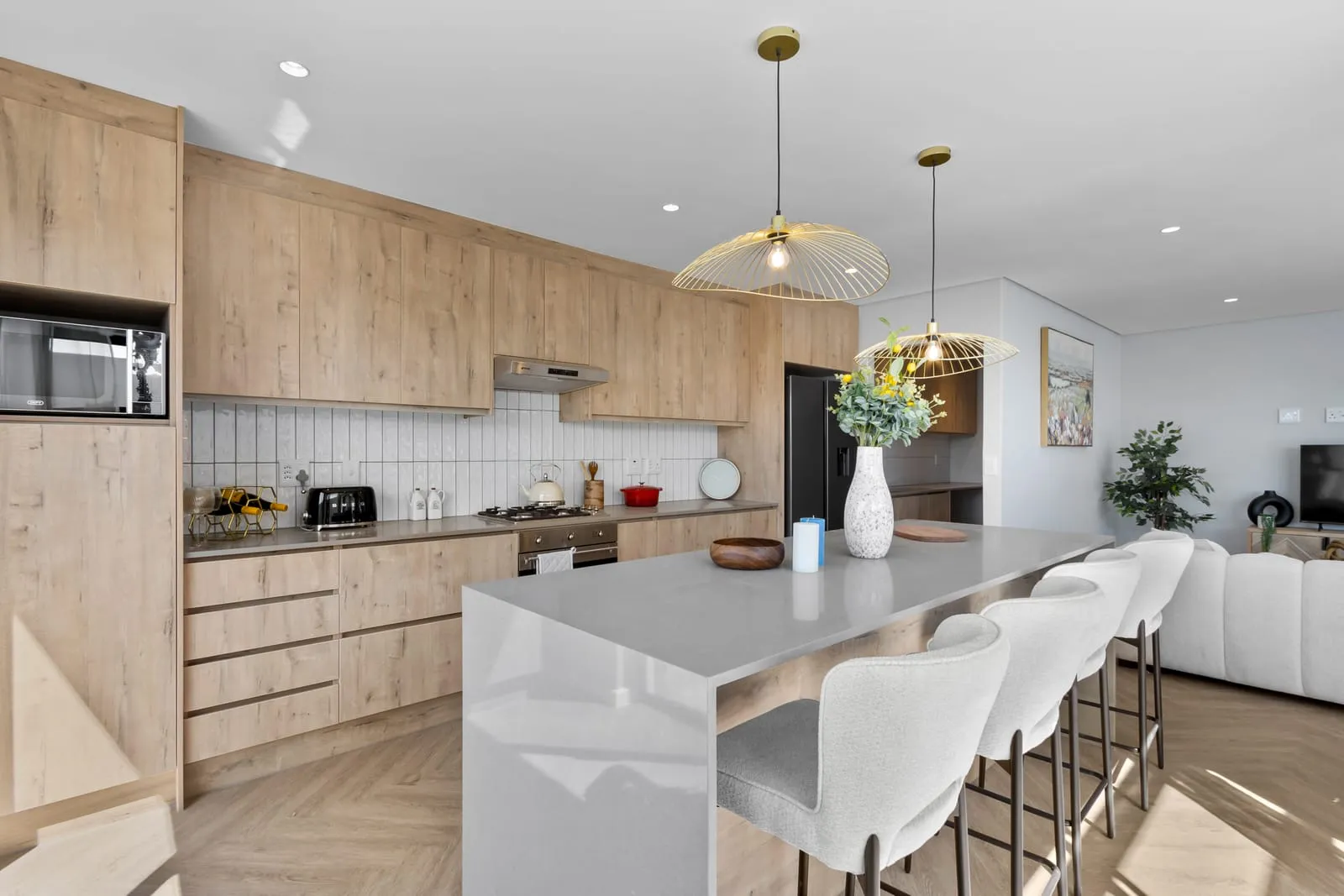 A bright open-plan kitchen in a managed rental